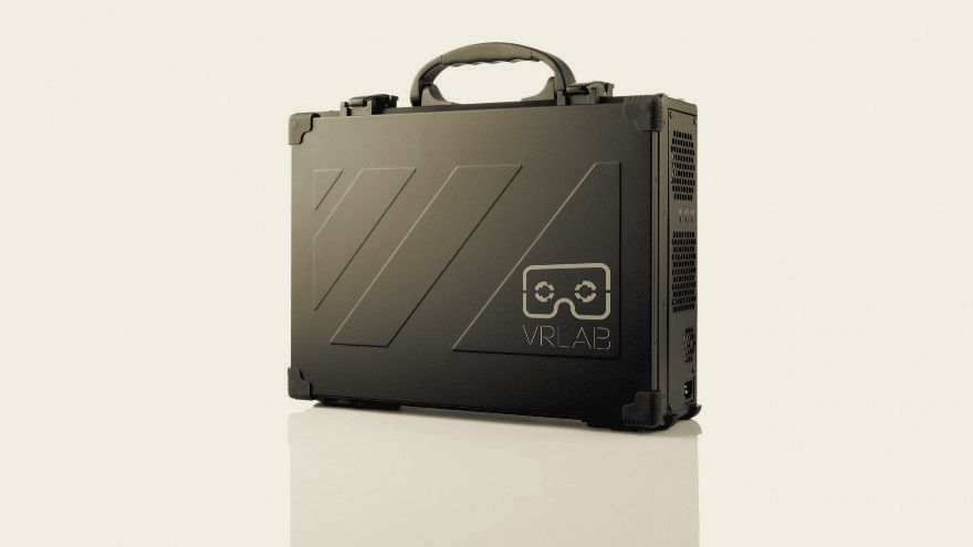 A closed black carry case with a handle, its lid embossed with diagonal lines and the lab's 2015 mark.